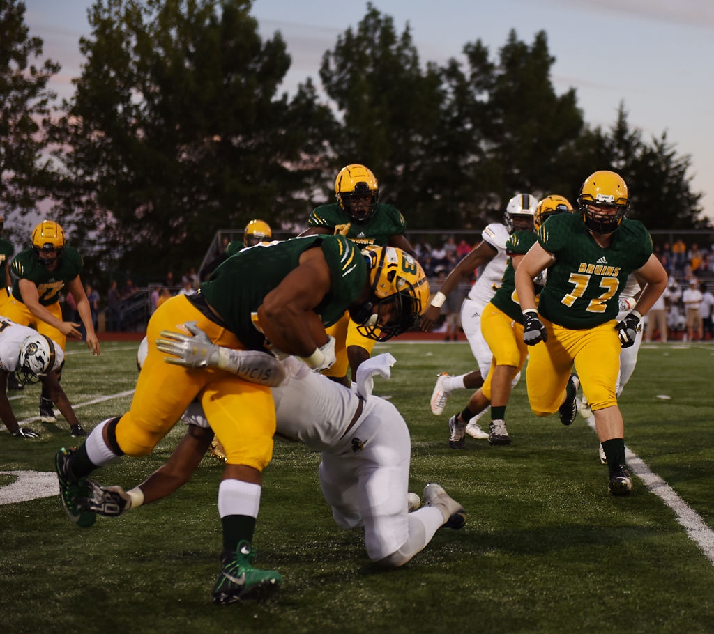 Rock Bridge junior running back Bryce Jackson breaks through